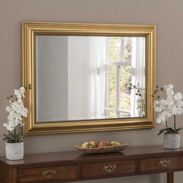 How to decorate bedroom with gold framed mirror